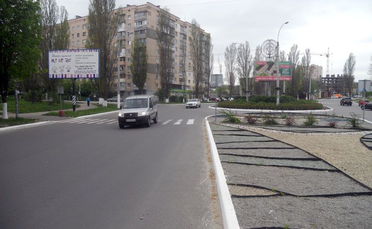Билборд Вышгород,  Вишгород вул.Шолуденко,6-Г/Мазепи/клумба (напр.на трасу Київ-Іванків) (В)