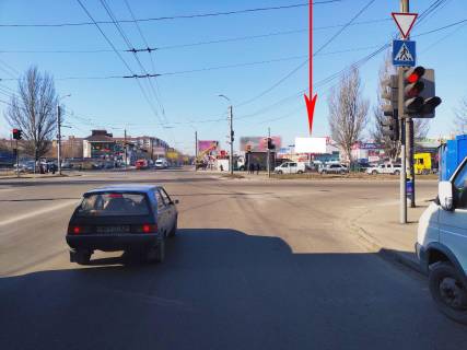 Білборд, Бігборд (Борд)  A у Дніпро (Дніпропетровськ), 6х3  вул. Донецьке шосе - вул. Березинська, перехрестя, ТРЦ "Караван", ринок, біля світлофора Фото 1