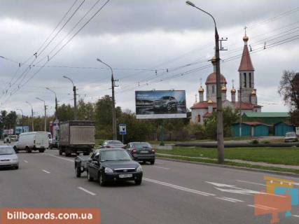 Билборд A в Кременчуге просп. Л.Украинки (50л.Октября), перекр. с ул. Козацкой (Сов.Армии), 5 (278-й кварт.), напротив супермаркета «Маркетопт», направление в центр фото 1