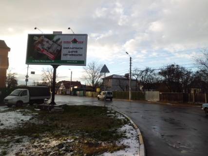 Билборд B в Буче на розі вул. Жовтнева та вул. Вокзальна (на з/д переїзді) фото 1