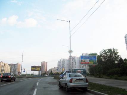 Білборд, Бігборд (Борд)  A у Києві, 6х3  Ревуцького вул., 25 (Фуршет, Приватбанк, Білла), на перетині з Ахматової Анни вул., в напрямку Здолбунівська вул Фото 1