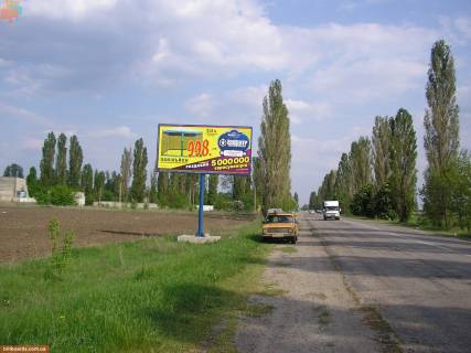 Билборд B в Васильевке траса Р-37 Енергодар – Василівка – Бердянськ, ліворуч, 28 км. до поста ДАІ м. Василівка, 750 м. до ж/д переїзду м. Дніпрорудне, у напрямку м. Василівка фото 1