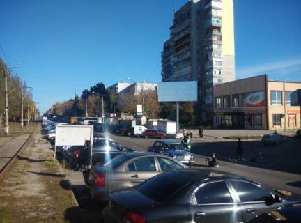 Білборд, Бігборд (Борд)  A у Запоріжжі, 6x3  Вул.8 березня ( пр. Моторобудівників)— вул. Кругова, вход на рынок Анголенко, «Ева» Фото 1