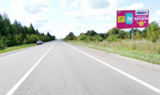 Билборд A в Радехове, 6x3м.  м. Радехів, вул. Львівська, 80, виїзд з міста в напрямку м. Львів, м. Камянка - Бузька, траса Львів - Луцьк (Н-17) + АЗК + жовта вітрозахисна люмінесцентна рамка + висока конструкція фото 1