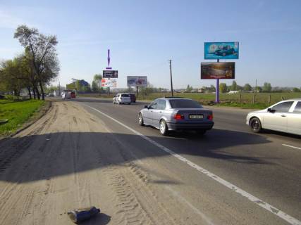 Білборд, Бігборд (Борд)  A у Києві, 6 X 3 м  Кільцева дорога, 200 м до готелю "Нотеl", навпроти ринку а\з "Жуляни" Фото 1