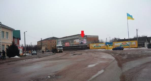 Білборд, Бігборд (Борд)  A у Черняхові, 3х6  ул. Ленина,2, центр, универмаг, напротив "Вопак", правая, в напр. на Житомир Фото 1