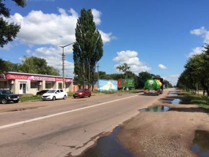 Білборд, Бігборд (Борд)  B у Коростені, 3х6  ул. Грушевского, 132, магазин завода лакокрасочных материалов "Янтарь", продмаркет "Завітай", в центр, в напр. от въезда со ст. Житомира Фото 1