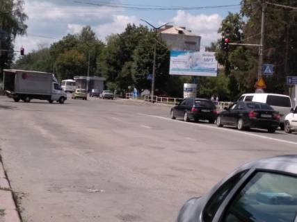 Білборд, Бігборд (Борд)  A у Звягель (Новоград-Волинський), 3х6  вул. Шевченко -Ніколаєва, ТЦ "Спутник", "Вопак", з центру Фото 1