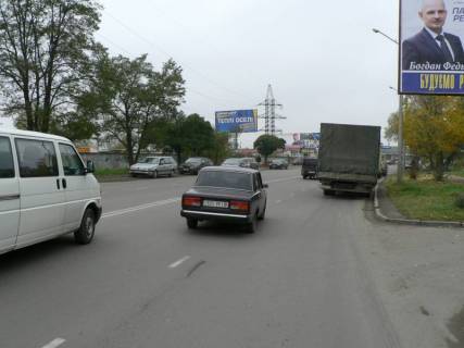 Білборд, Бігборд (Борд)  B у Івано-Франківську, 3x6  Довженка (Мазепи супермаркети Велес, Comfy) АЗС ТНК, авторинок, Льодова Арена, АЗС WOG, напрямок руху від вул.Коновальця (АЗС ОККО, супермаркет ВелМарт)  в напрямку Мазепи (Набережна) Фото 1