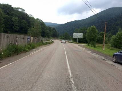 Білборд, Бігборд (Борд)  A у Микуличині, 3x6  Траса Н-09 Мукачево-Львів, 600 м перед АЗС УкрНафта, котедж Марципан, напрямок руху на Івано-Франківськ Фото 1