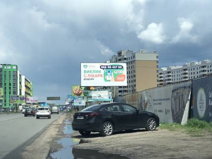 Білборд, Бігборд (Борд)  A у Вишневе, Board 3x6м  вул. В. Стуса, 46/вул. Освіти, заїзд до ЖК "Акварелі-2", 100м до "Novus", ЖК "Європейське Місто", ЖК "Піонерський", в бік м. Київ Фото 1