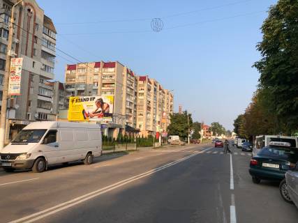 Білборд, Бігборд (Борд)  A у Новояворівську вул.Бандери 6-8 (біля автостоянки) стіна, верхня площина Фото 1