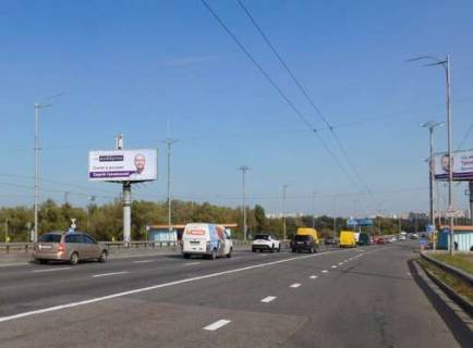 Білборд, Бігборд (Борд)  B у Києві, 5x12  Шухевича Романа просп. (Генерала Ватутіна просп.), : парк Дружби народів; Московський міст (у напрямку  Троєщини) Фото 1