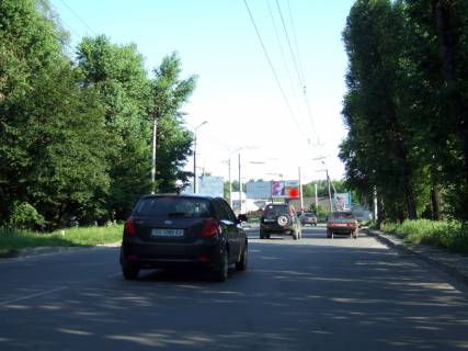 Білборд, Бігборд (Борд)  A у Хмельницькому, 3*6  Т-подібне перехрестя вул.Проскурівського підпілля - вул.Вокзальна. неподалік: велика автостоянка, парк, приватна забудова (в центр) [праве вухо] Фото 1