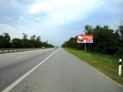 Билборд A в Київських трасах, 6х3  Траса М-06 "Київ-Чоп" (Житомир), км 42+850 ліво, через 650м після повороту на Мотижин, поворот на котеджне містечко "Німецька слобода" фото 1