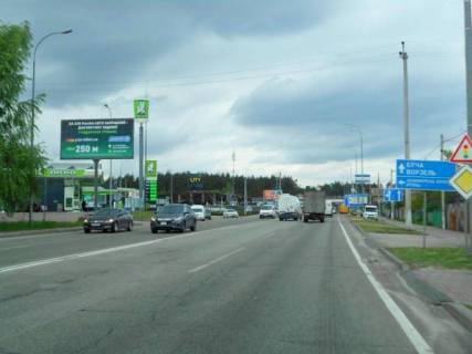 Білборд, Бігборд (Борд)  B у Гостомелі, 6х3  м. Гостомель-м. Ірпінь, вул. Шевченка-вул. Свято- Покровська (навпроти №10), перетин з вул. Гайдамацька, траса М-07, км 23+550 ліво, біля АЗК ОККО, Сіті Маркет Фото 1
