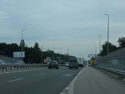 Білборд, Бігборд (Борд)  B у Київських трасах, 6х3  с. Мила, траса М-06 "Київ-Чоп" (Житомир), км 25+280 право, за 400м до повороту на Ворзель, через 400м після повороту на Дмитрівку, біля АТБ Маркету Фото 1