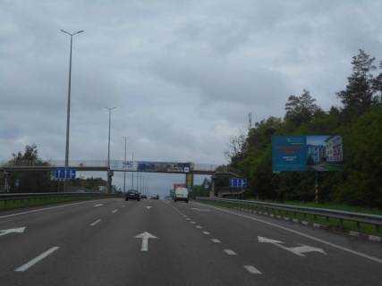 Білборд, Бігборд (Борд)  A у Капітанівке, 6х3  с. Капітанівка, траса М-06 "Київ-Чоп" (Житомир), км 24+100 право, поворот на Бучу, автобусна зупинка Капітанівка Фото 1