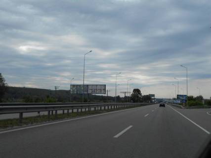Білборд, Бігборд (Борд)  B у Ходосівці, 12х3  Дніпровське шосе, траса Н-01 "Київ-Знам'янка", км 25+120 право, розв'язка на с. Креничі, лівий Фото 1