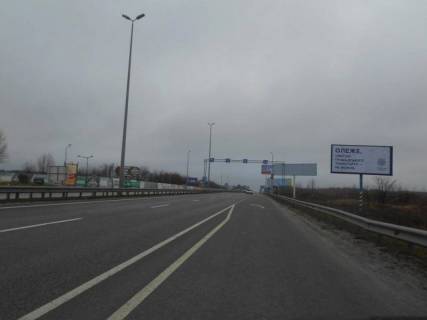 Билборд A в Київських трасах, 6х3  с. Мила, траса М-06 "Київ-Чоп" (Житомир), км 26+700 право, за 650м перед  АЗС GLUSCO, навпроти ресторану "Два бобра" фото 1