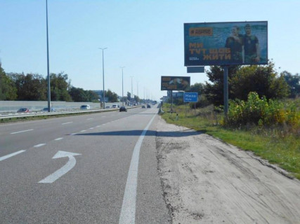 Білборд, Бігборд (Борд)  A у Міла, 6х3  с. Мила, траса М-06 "Київ-Чоп" (Житомир), км 26+800 ліво, біля садового центру, за 550м до магазину "Фора", через 625м після АЗС GLUSCO Фото 1