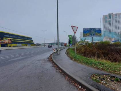Билборд A в Гатном, 6х3  с. Чабани, початок проспекту Академіка Глушкова, траса М-05 Київ-Одеса, км 13+800 ліво, заїзд на АЗС ОККО, виїзд з Нової Лінії, навпроти представництво КЕРХЕР, АТБ фото 1